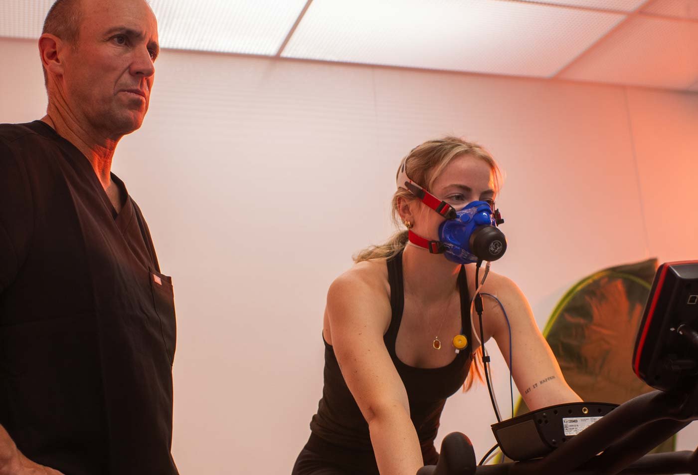 A student performs research on exercise equipment, demonstrating hands-on research in the PhD in Exercise and Nutritional Sciences.