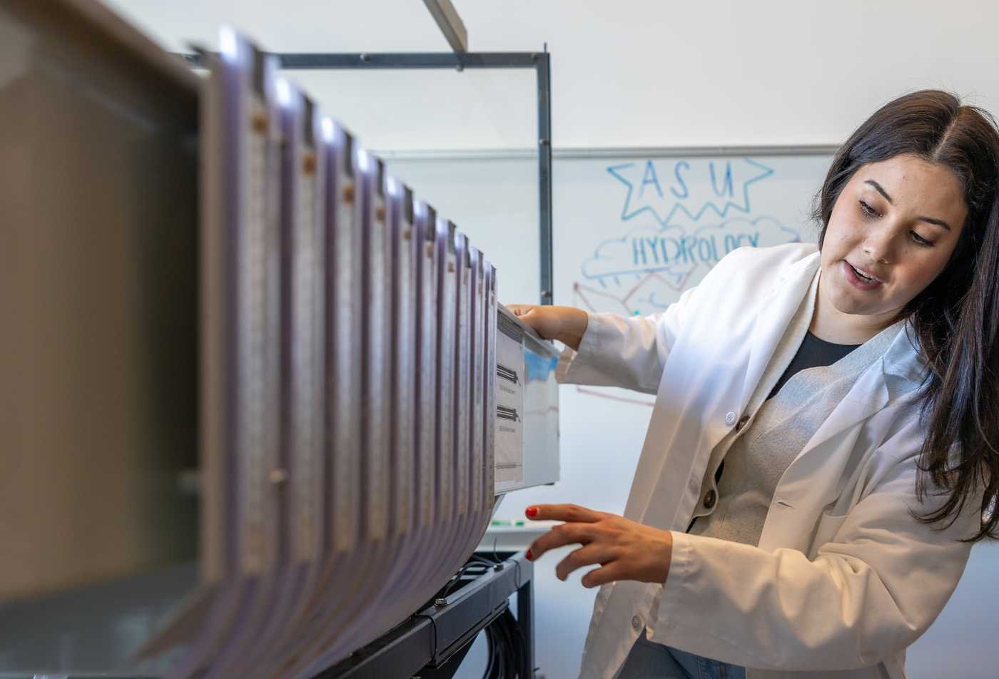 A researcher conducts an experiment inside a classroom, demonstrating hands-on learning in the certificate in Health Education Specialist