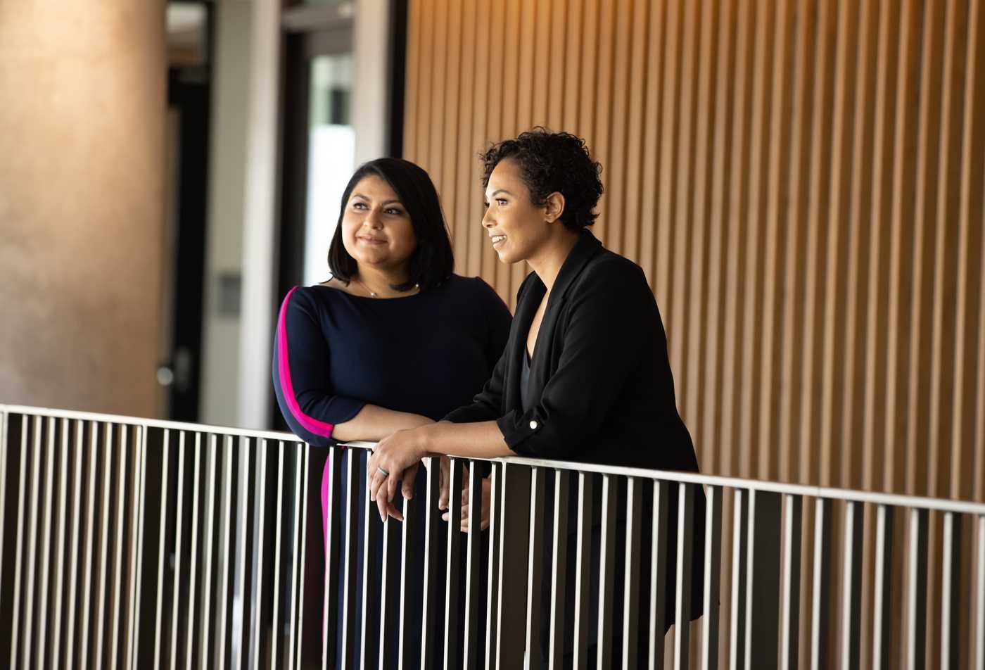 Two addiction psychology professionals talk outside after class, showcasing the expertise gained in the MS in Addiction Psychology.