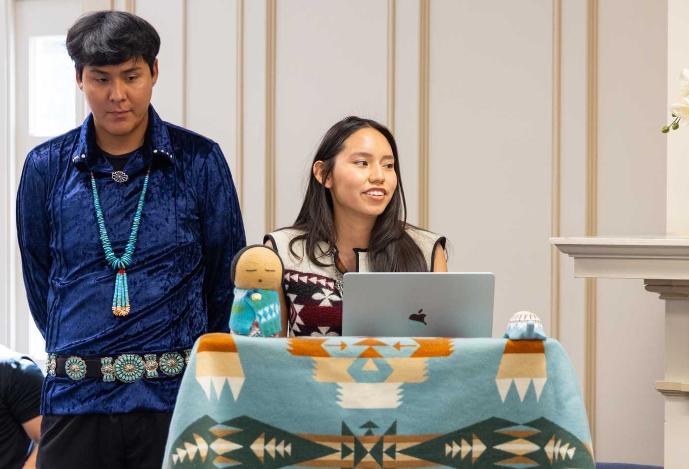 Ms. and Mr. Indigenous present at an American Indian Studies celebration event, showing the community experiences available in the BS.