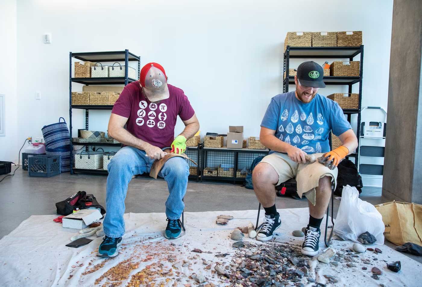 Two anthropology students examine historical artifacts, showcasing hands-on learning in the PhD in Anthropology.