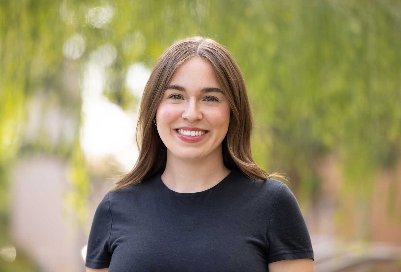An astrophysics student smiles on Tempe campus, reflecting the expertise gained in the minor in Astrophysics.
