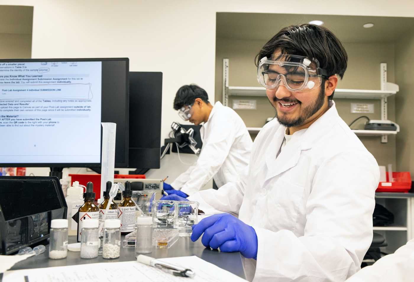 A student conducts a lab experiment, developing research skills in ASU's Biochemistry, BS program.