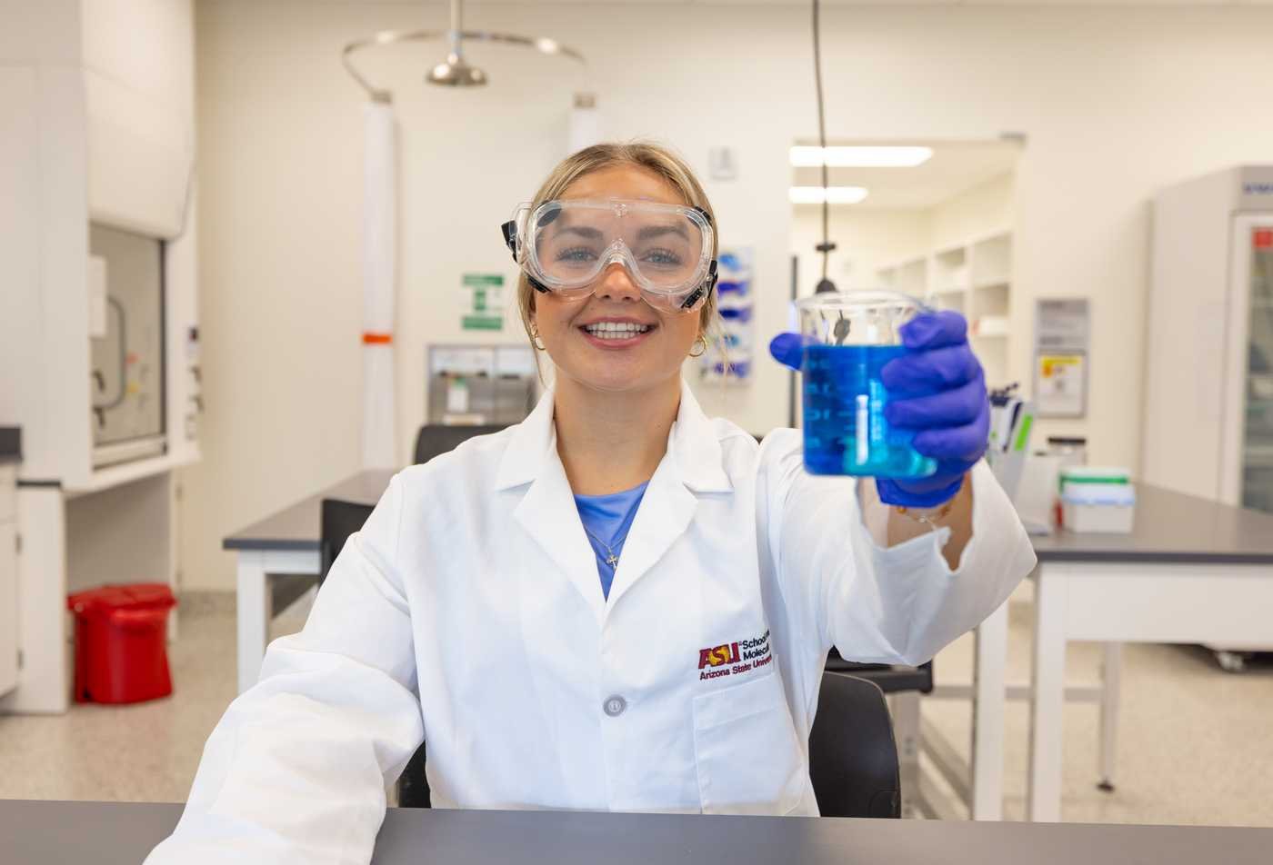 A student conducts chemical experiments, showcasing hands-on learning in the MS in Biochemistry (Medicinal Chemistry).