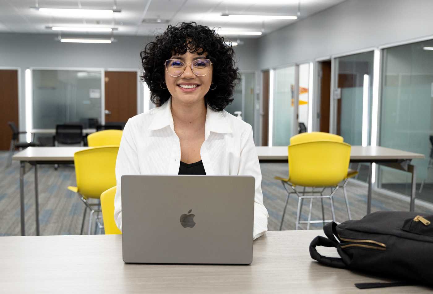 A student studies at a laptop, reflecting flexible learning in the certificate in Border Studies.