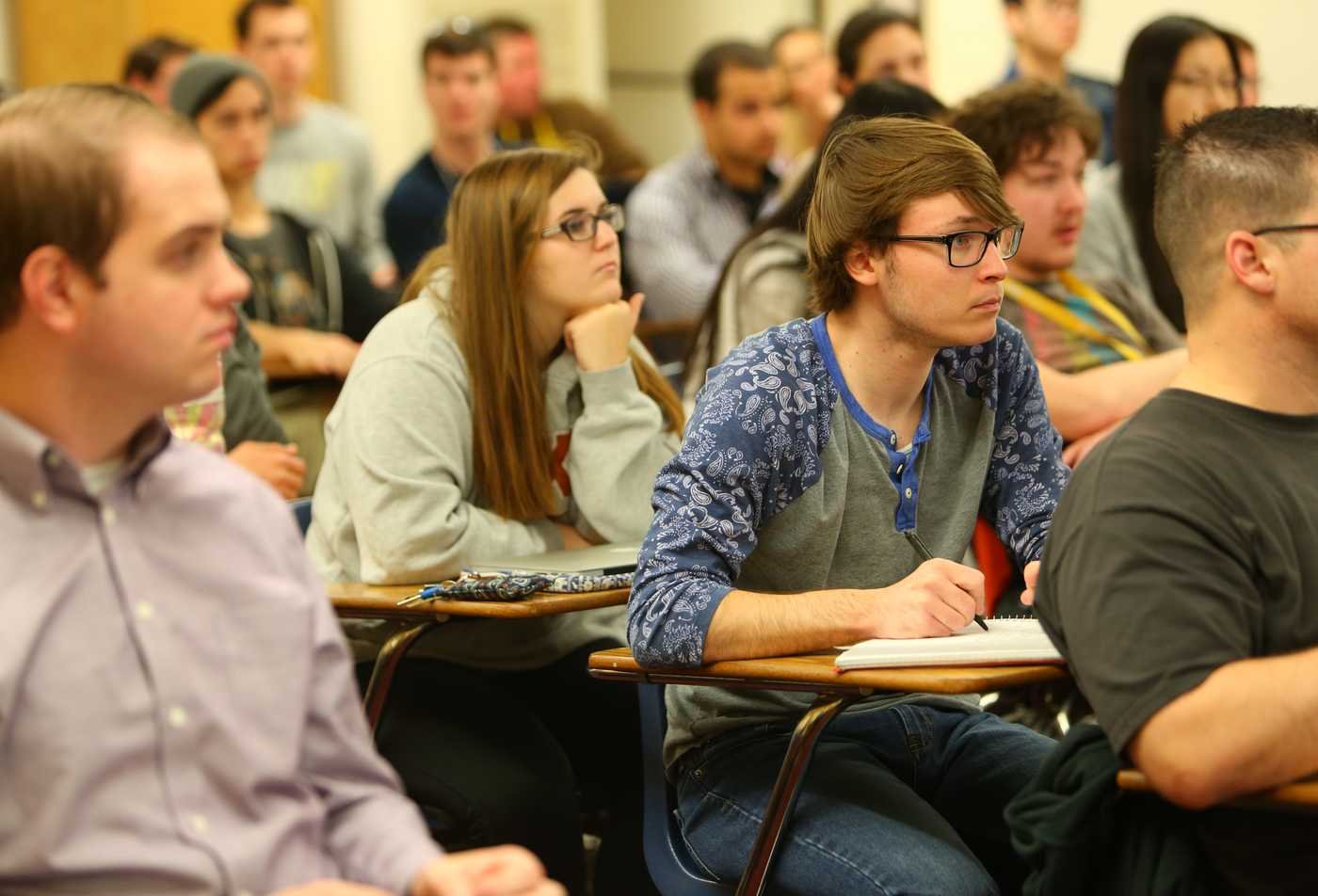 Students sit in a classroom during a lecture, leveling up their knowledge in the minor in Computational Mathematical Sciences.