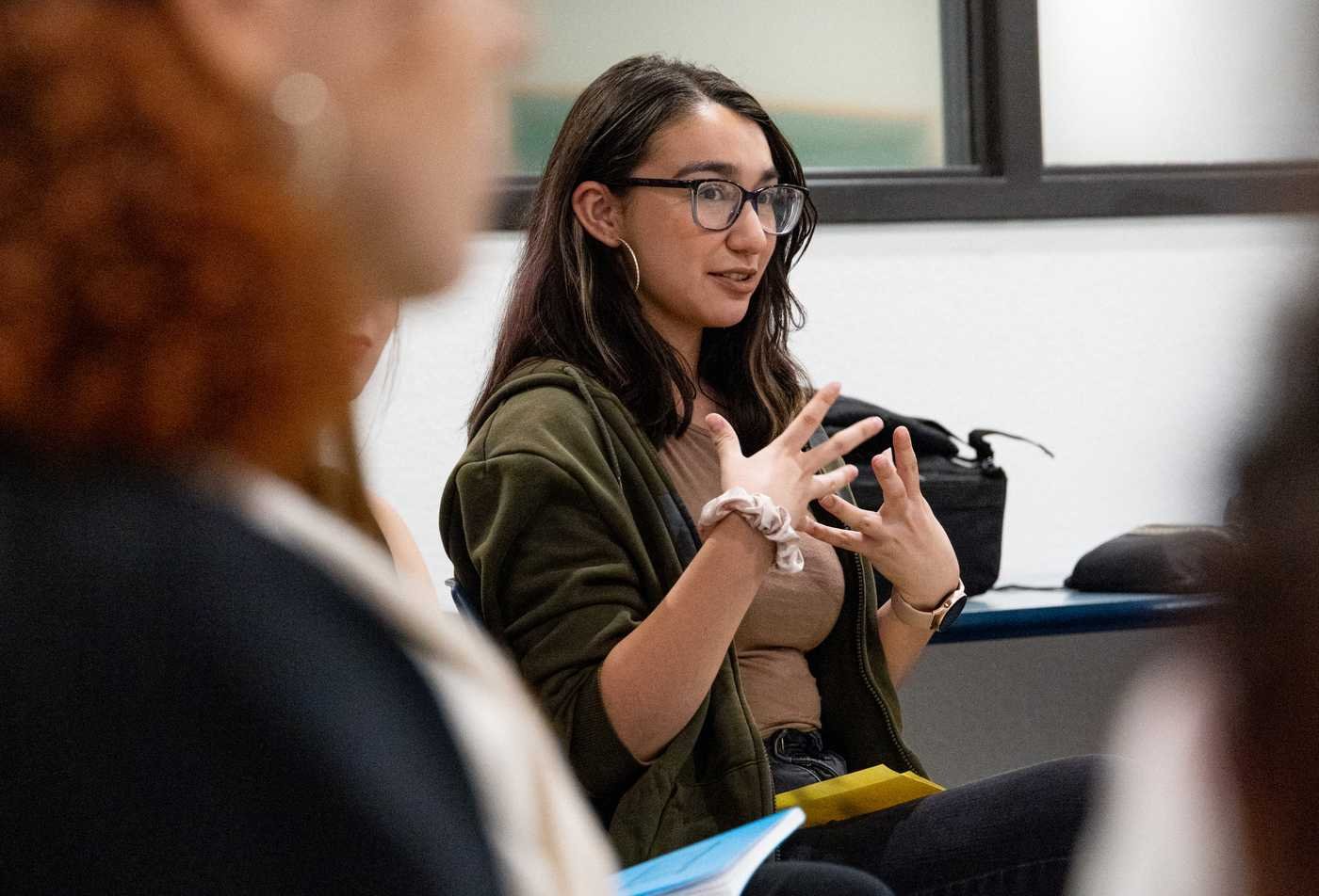 A student shares ideas during a group discussion, reflecting interpersonal communication in ASU's Communication, BA program.