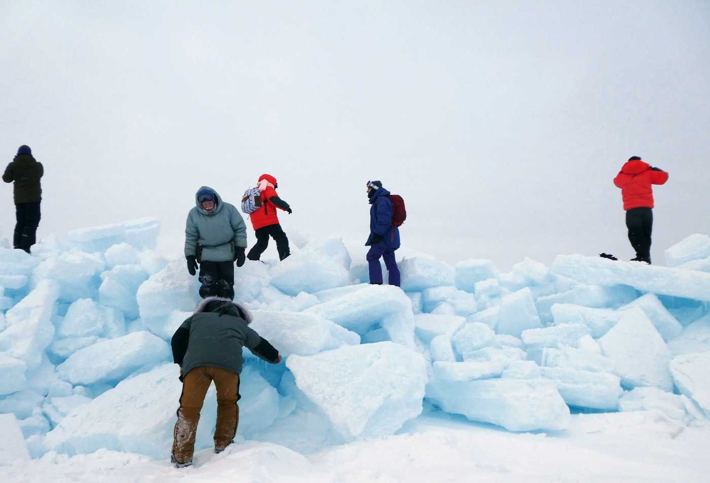 Students explore a freezing arctic environment, demonstrating hands-on learning in the PhD in Environmental Social Science.