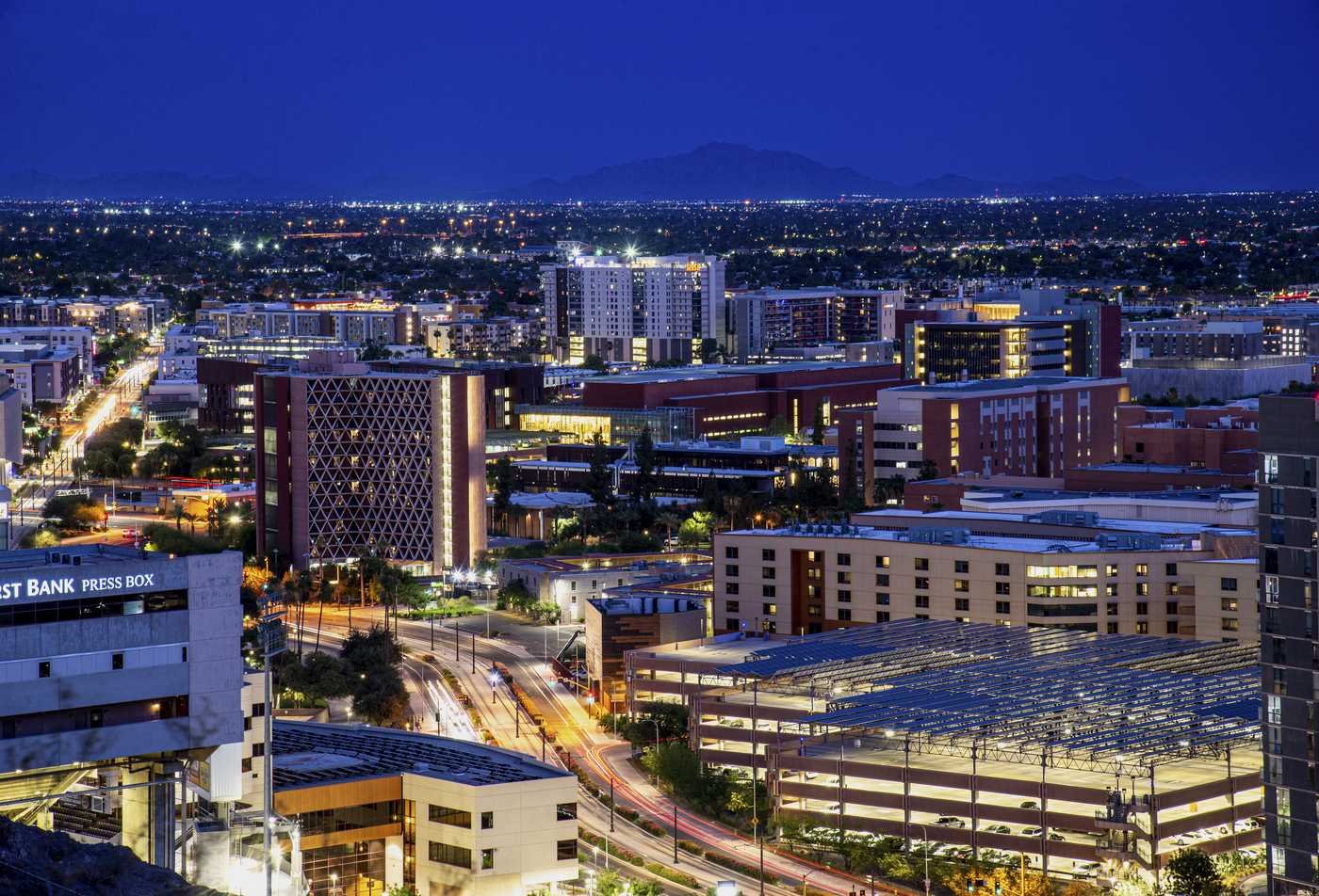A cityscape at night reflects the field explored in the Environmental Social Science (Urbanism), PhD