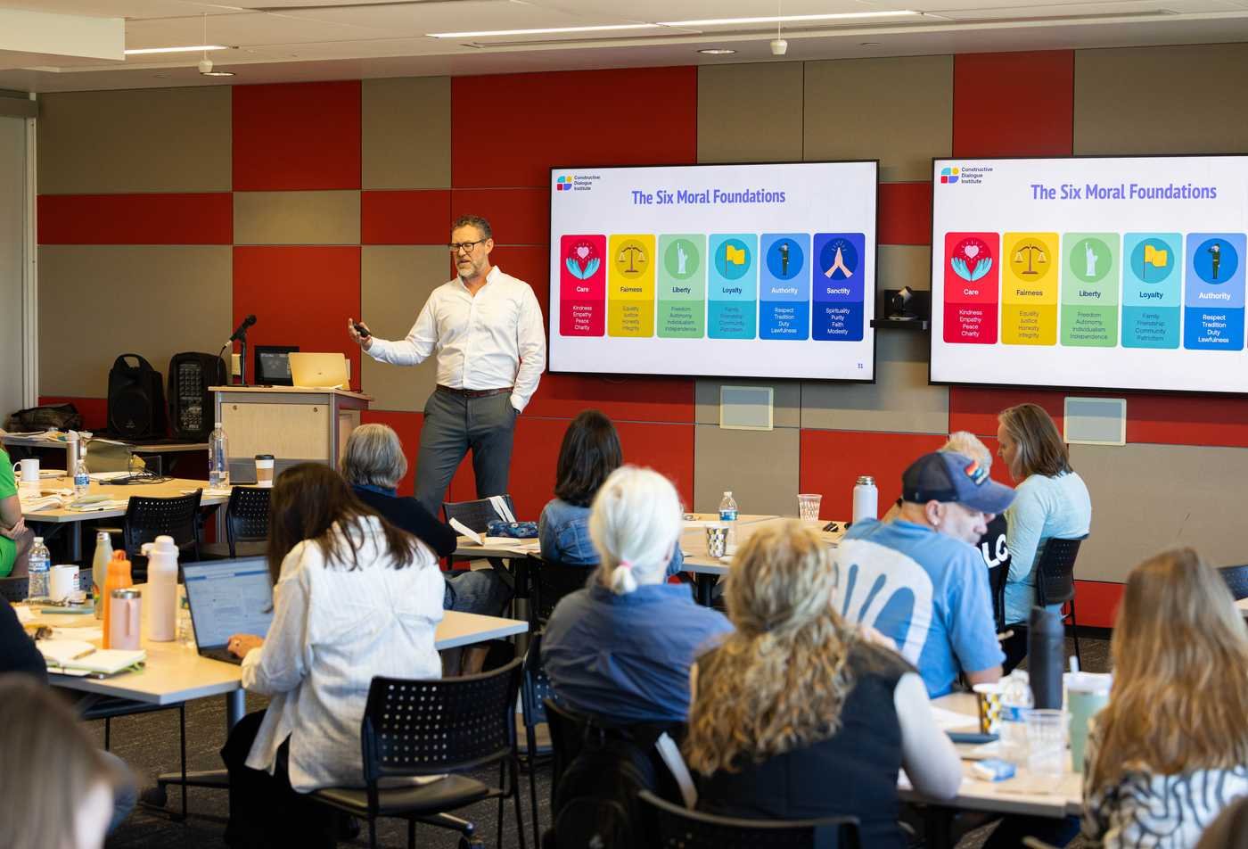 Professor presents a lesson on ethics to a classroom, showcasing the field explored in the certificate in Ethics.