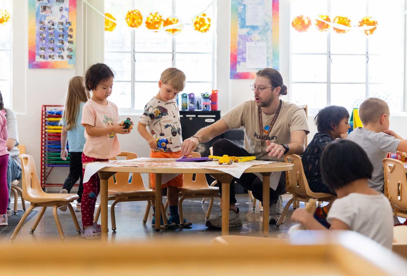 A teacher interacts with a classroom of young students, reflecting the field explored in the minor in Family and Human Development.