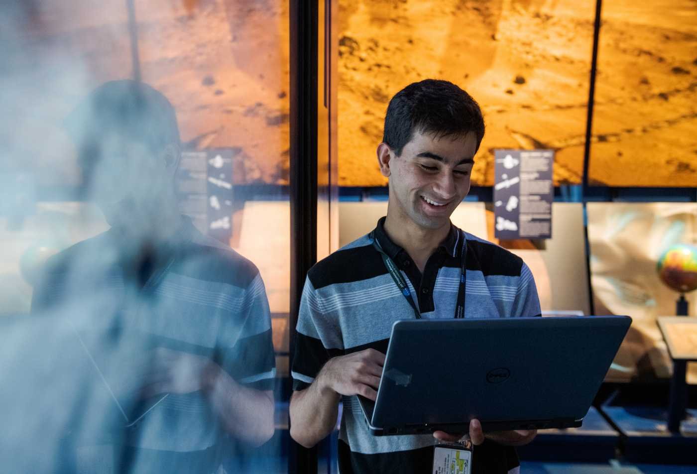 A student studies satellite imagery on a desktop computer, showcasing the field explored in the minor in Geography.