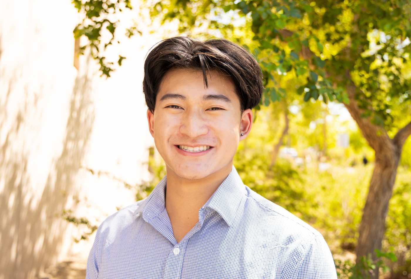 An ASU student smiles into the camera, demonstrating expertise gained in the Global Security (Intelligence Studies), MA.