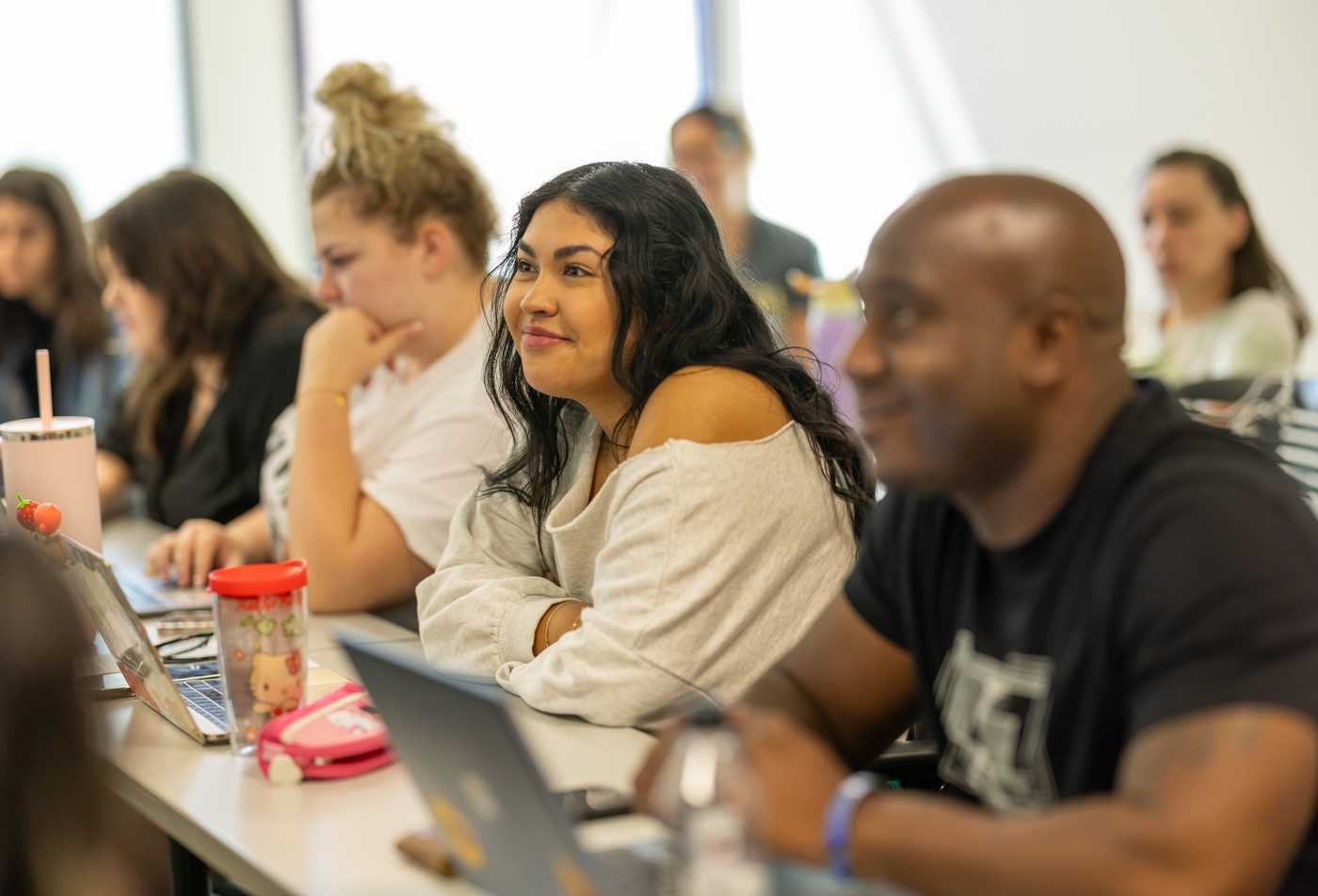Students listen attenatively during a class, developing skills in the certificate in International Relations.