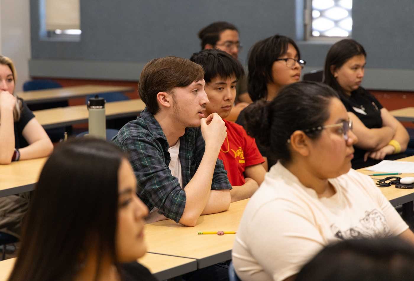 Students listen during a classroom discussion, connecting disciplines in ASU's Integrated Studies, BA program.
