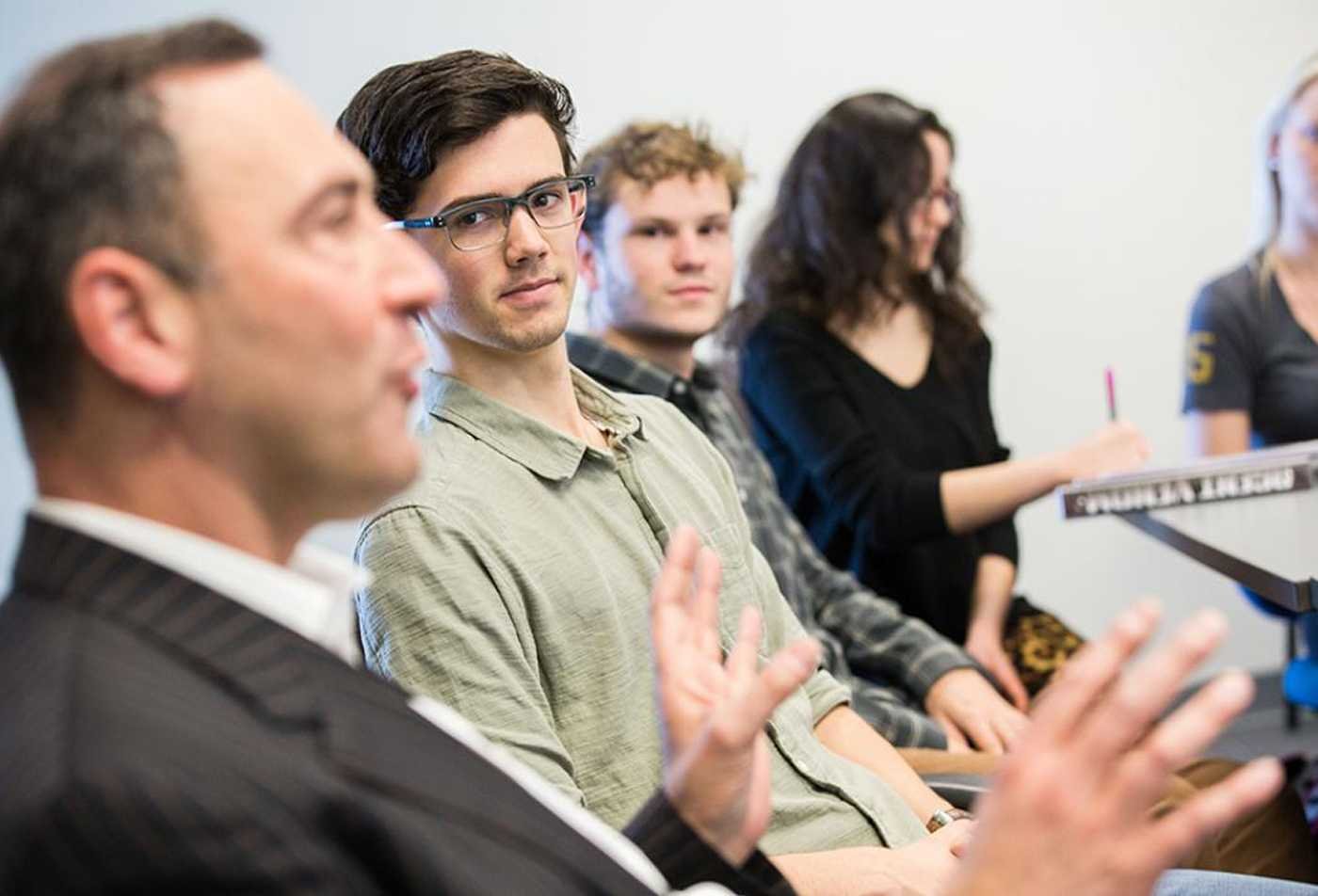 Students listen attenatively during a class, developing skills in the certificate in Jewish Studies.