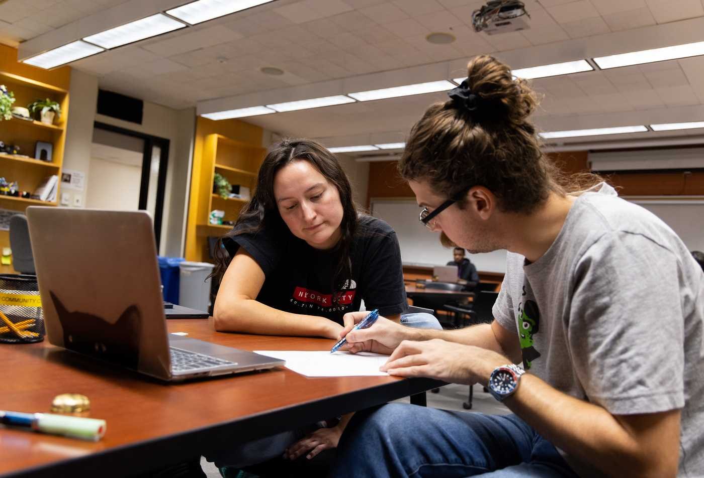 Two students study together, showcasing collaborative learning in the Mathematics, MA.