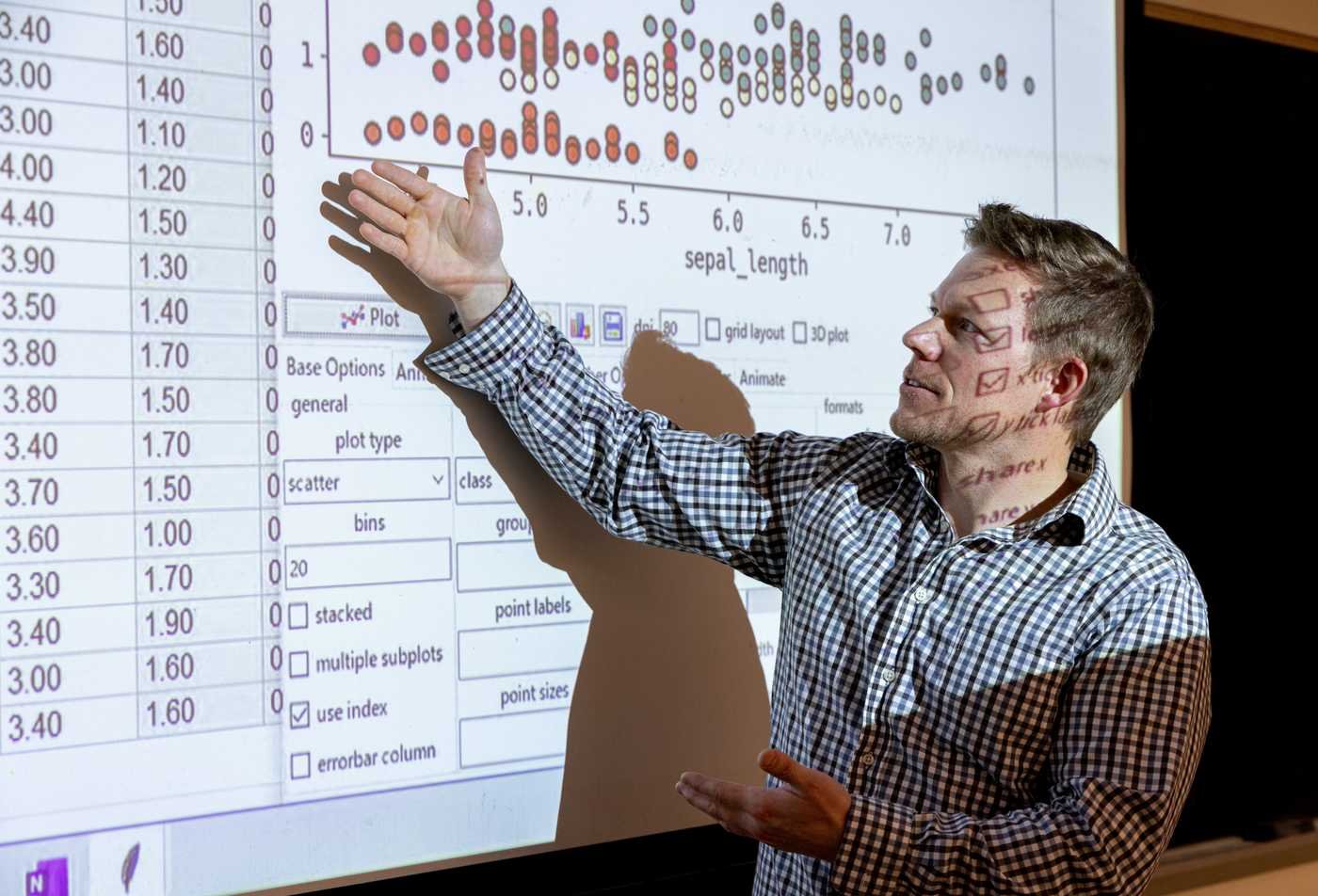 A researcher analyzes survey data, applying quantitative methods in ASU's Mathematics (Statistics), BS program.