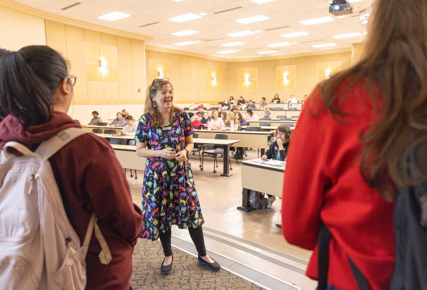 An instructor engages students in a lecture hall, exploring behavior and cognition in ASU's Psychology, BS program.