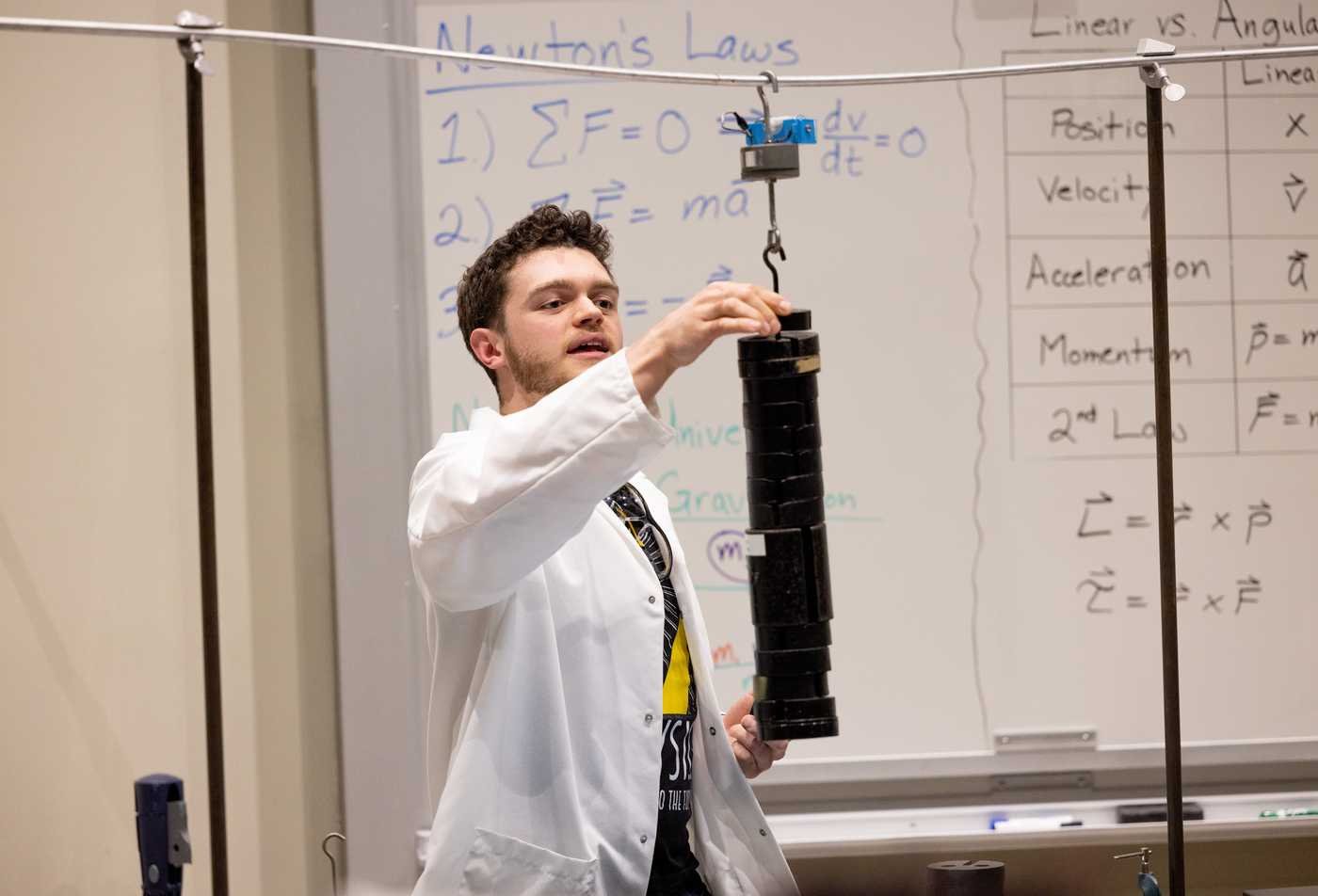 A student performs a physics test, demonstrating hands-on learning in the Physics, MNS.