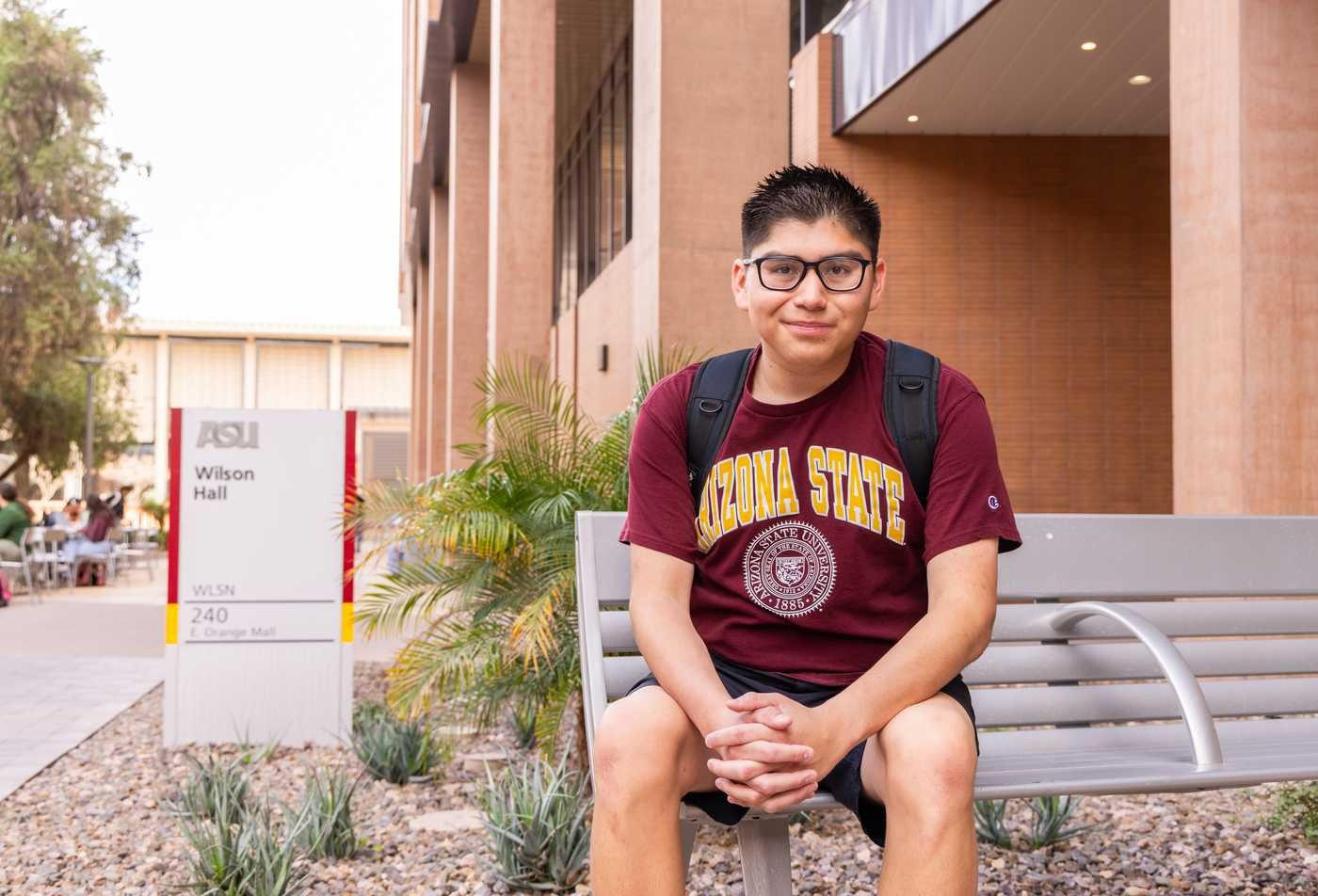 A student poses outside on university campus, symbolizing expertise gained in the Political Science, PhD.