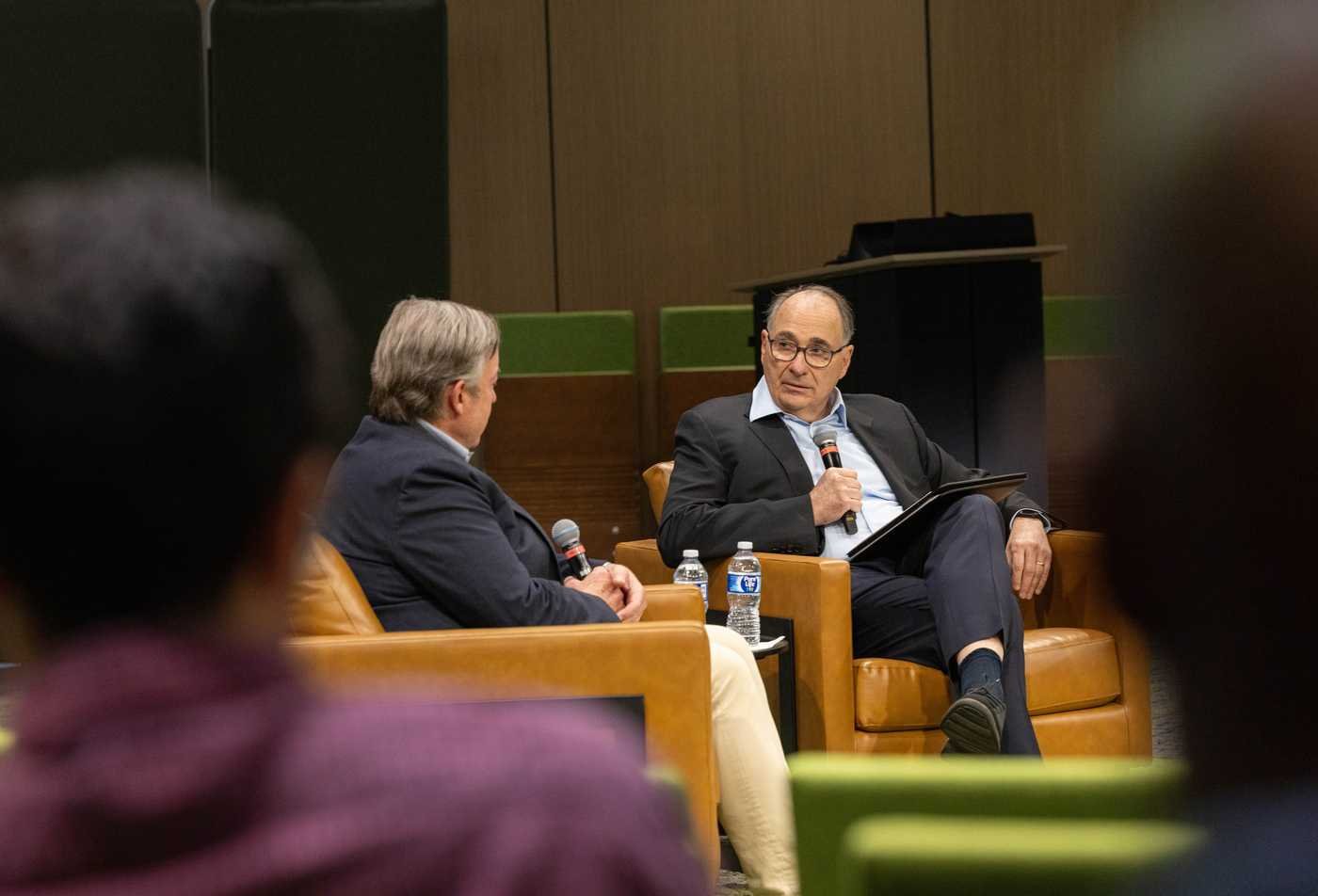 David Axelrod, a political consultant, speaks to ASU President Michael Crow, symbolizing the field of Political Psychology, MA.