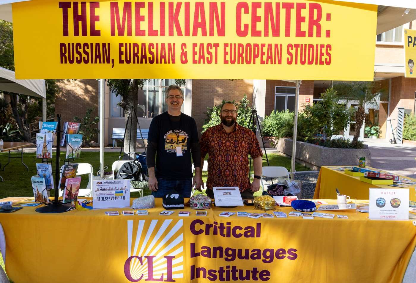 Two faculty members present a booth on Russian, Eurasia and East European Studies, showcasing the experience gained in the certificate in Russian and East European Studies.