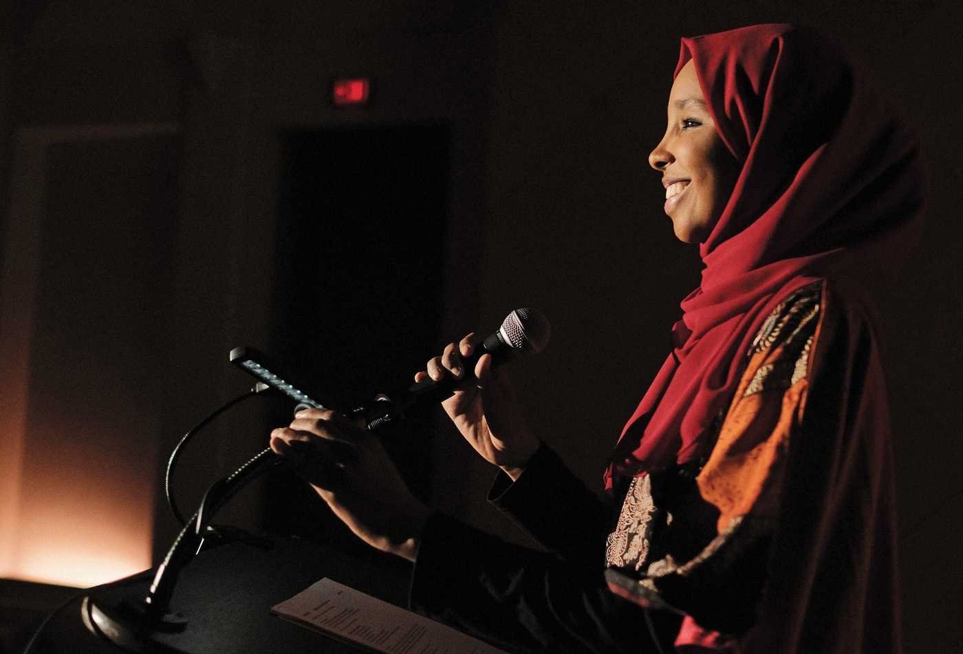 A speaker addresses an audience, exploring faith and global issues in ASU's Religious Studies (Religion, Politics and Global Affairs), BA program.