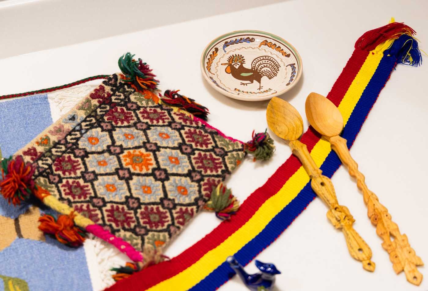 Colorful cultural Romanian items are laid out on a table, showcasing the field explored in the minor in Romanian.