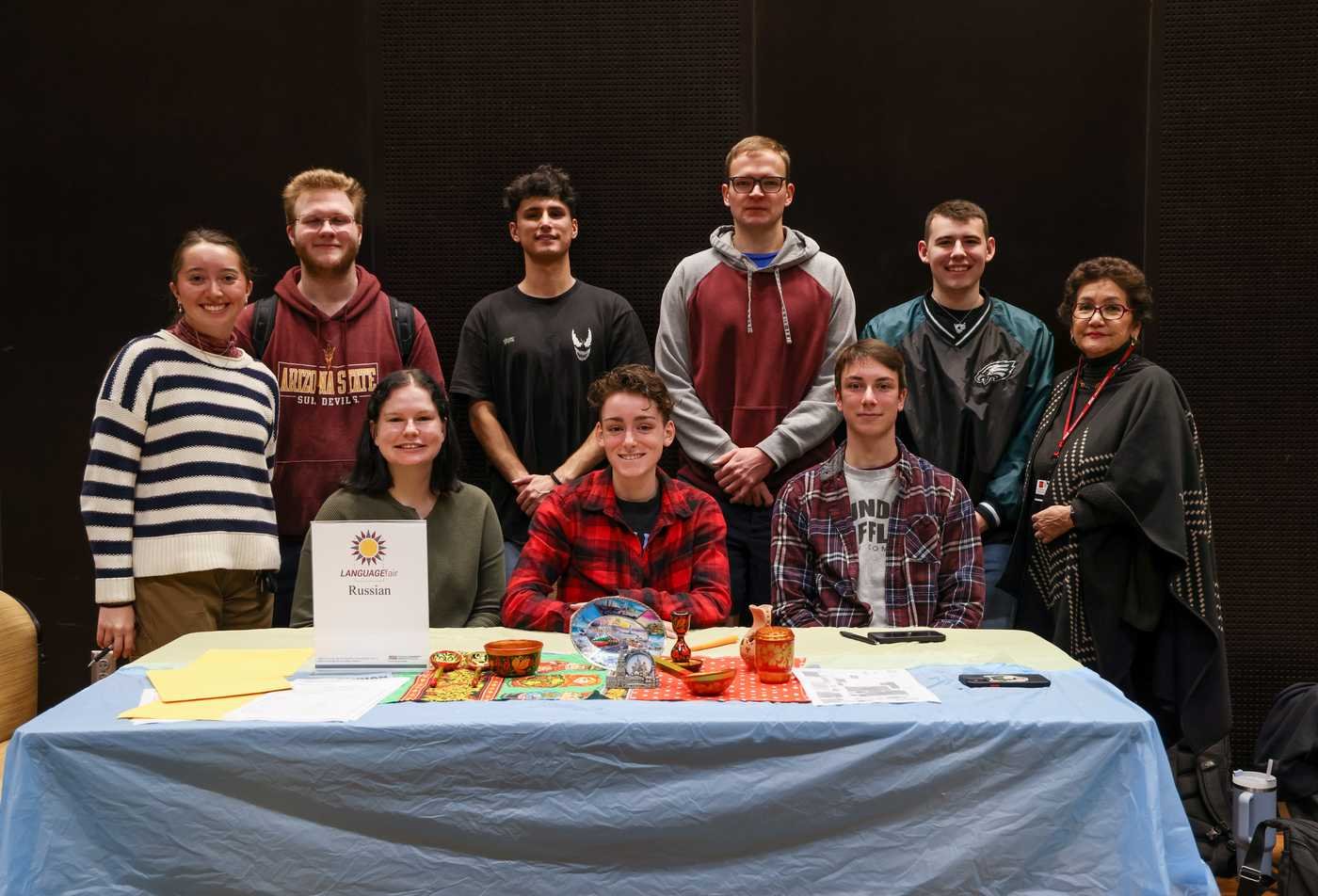 A group of students and faculty gather together to promote the Russian program at the annual Language Fair, showcasing the experience of the BA in Russian.