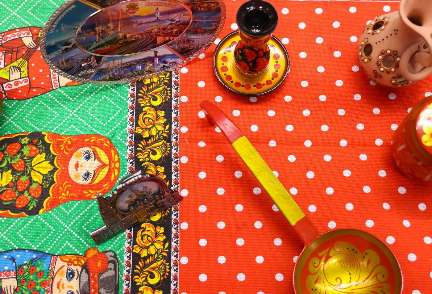 Colorful cultural Russian items are laid out on a table, showcasing the field explored in the minor in Russian.