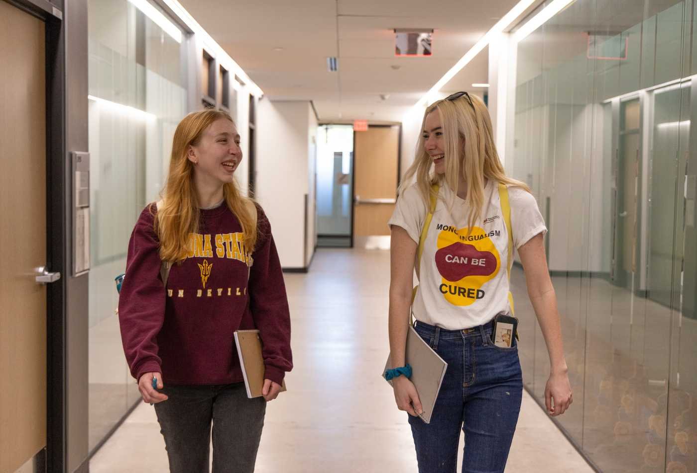 A student wears a shirt that says "Monolingualism can be cured." highlighting the value of the Spanish, MA.