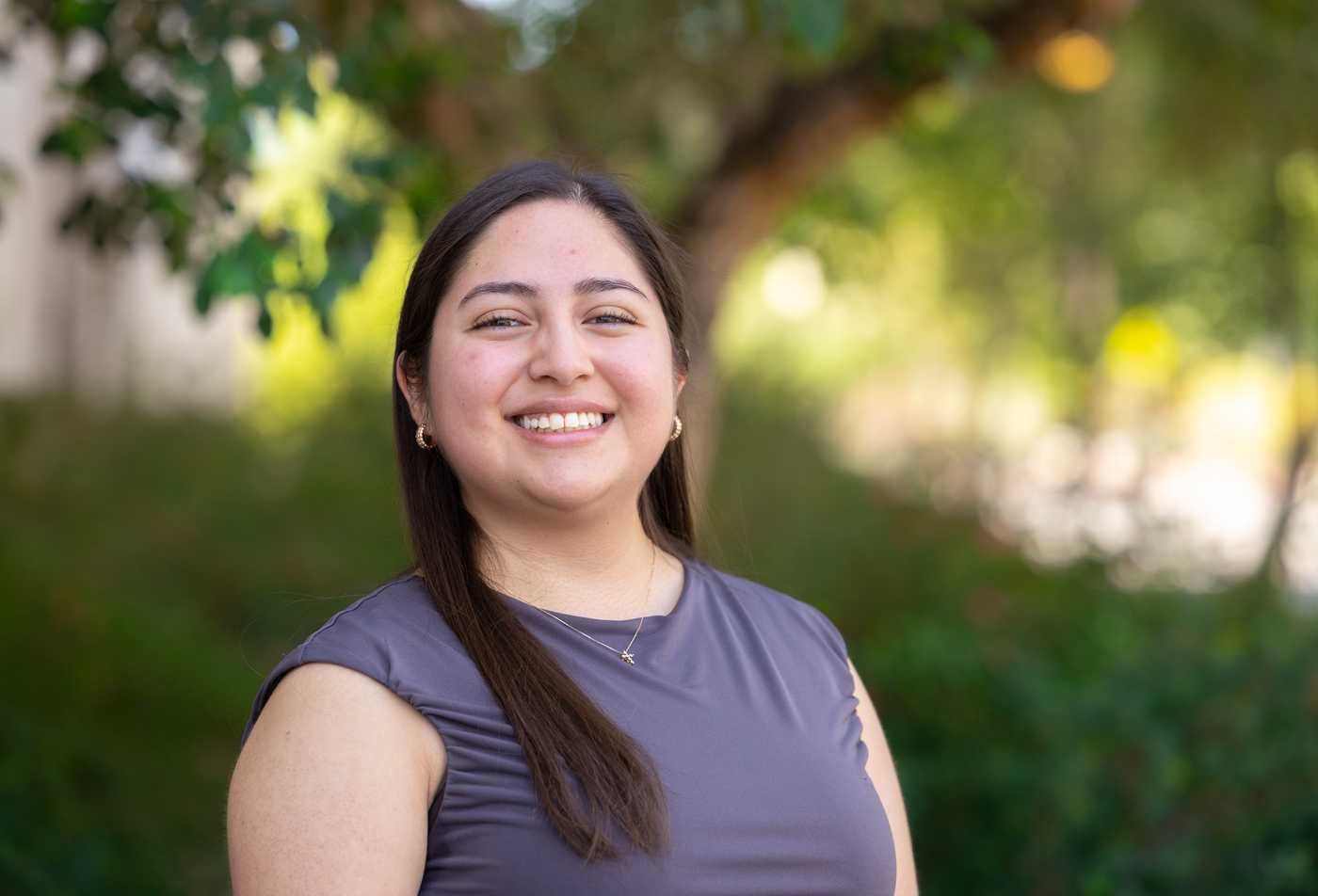 A Transborder Studies student smiles into the camera, demonstrating expertise in the Transborder Studies, PhD.
