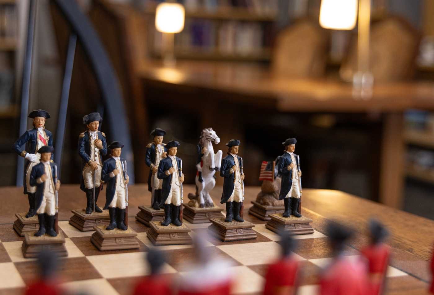 Historic chess pieces symbolize strategy and ethics in the War and Strategy, MA.