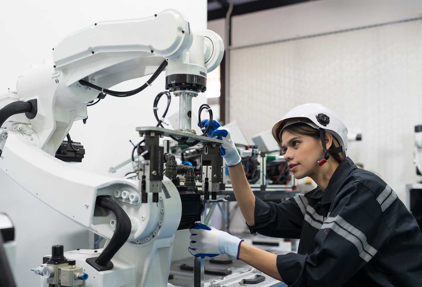 A technician works with robotic equipment, reflecting cross-disciplinary learning in ASU's Interdisciplinary Studies, BA program.