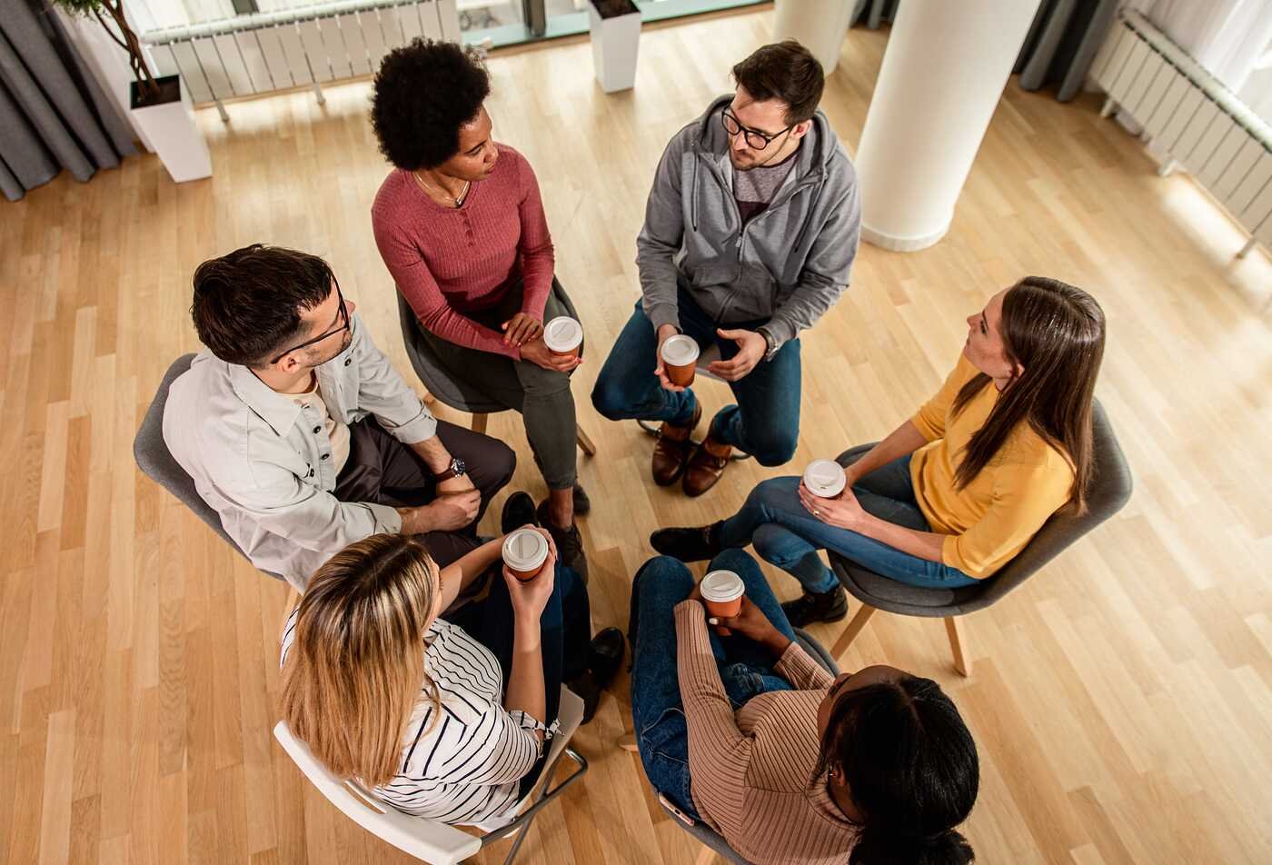 A group sits in a circle, discussing peer support in ASU's Counseling and Applied Psychological Science (Substance Abuse and Addictions), BS program.