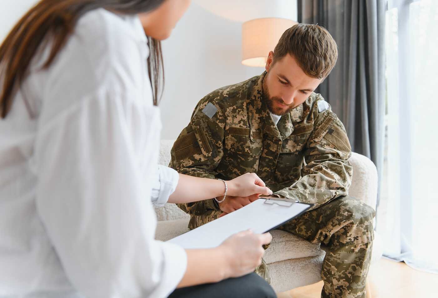 A counselor meets with a service member, demonstrating the field explored in ASU's Counseling and Applied Psychological Science (Counseling Military Members and Veterans), BS program.