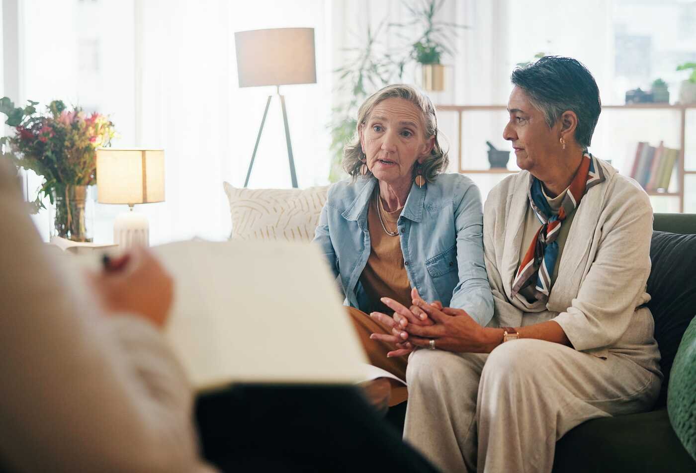 Counselor listens during a session, demonstrating the field explored in ASU's Counseling and Applied Psychological Science (Sexuality and Gender Issues in Counseling), BS program.