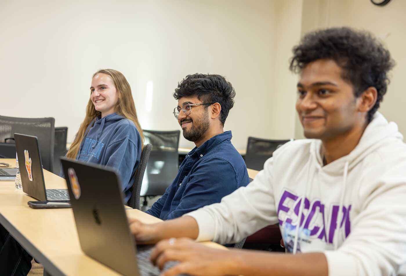 Students use laptops during class, reflecting broad interdisciplinary learning in ASU's General Studies, BA program.