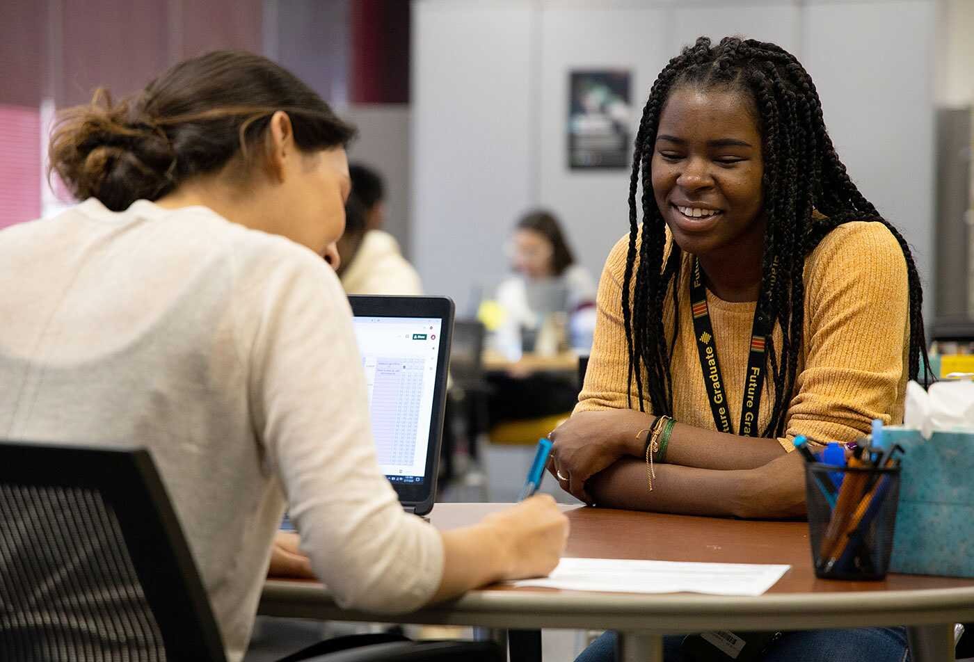 Two students collaborate together, supporting advanced social research in ASU's Integrative Social Science, MS program.