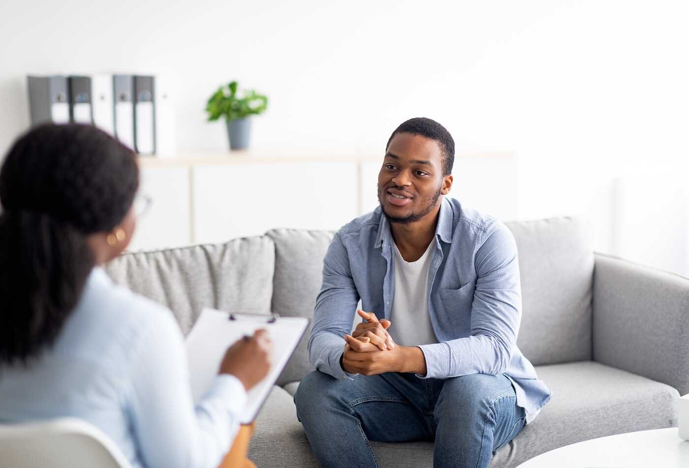 A client meets with a counselor, demonstrating the behavior and well-being topics explored in ASU's Psychology, BS program.