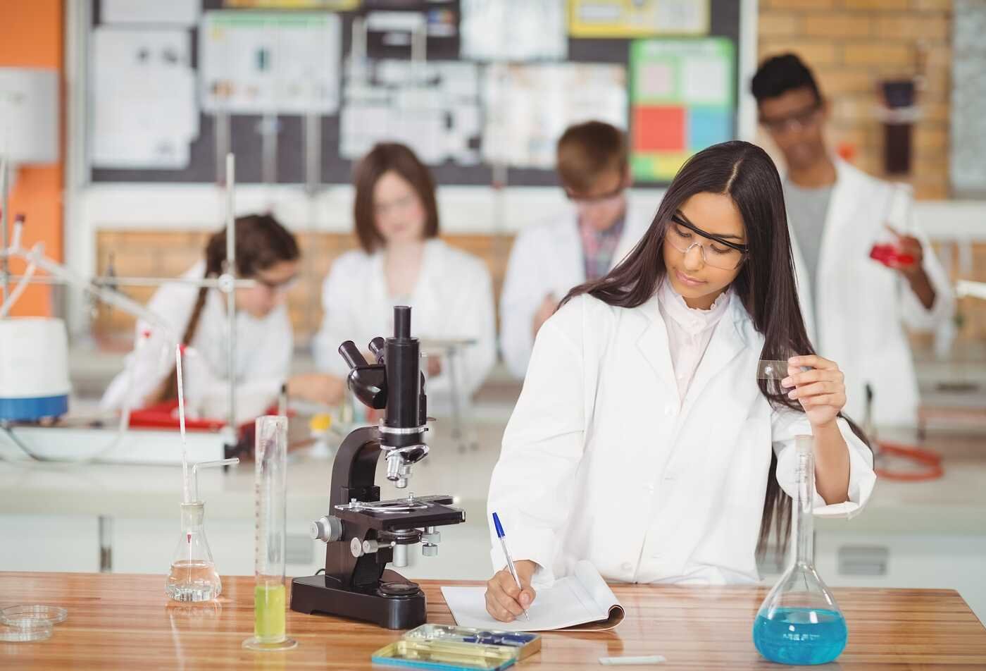 A student conducts a laboratory experiment, demonstrating scientific inquiry in ASU's Physics minor.