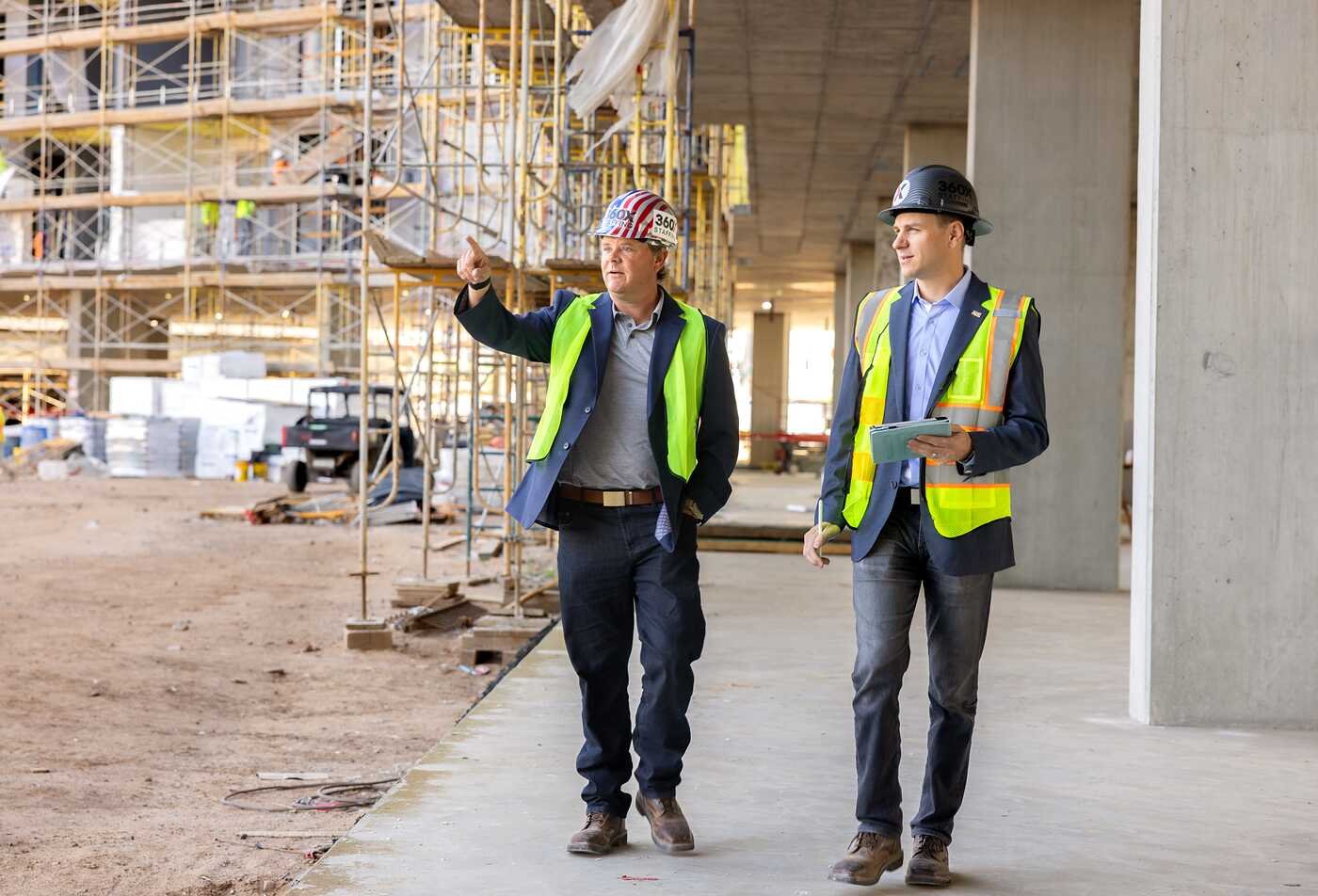 Construction managers review a project site, demonstrating leadership in ASU's Project Management, MPM program.