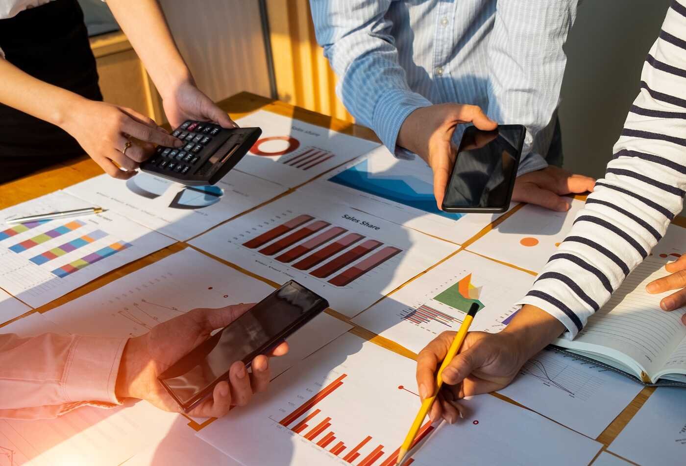 A team reviews charts and project data, building planning skills in ASU's Project Management minor.
