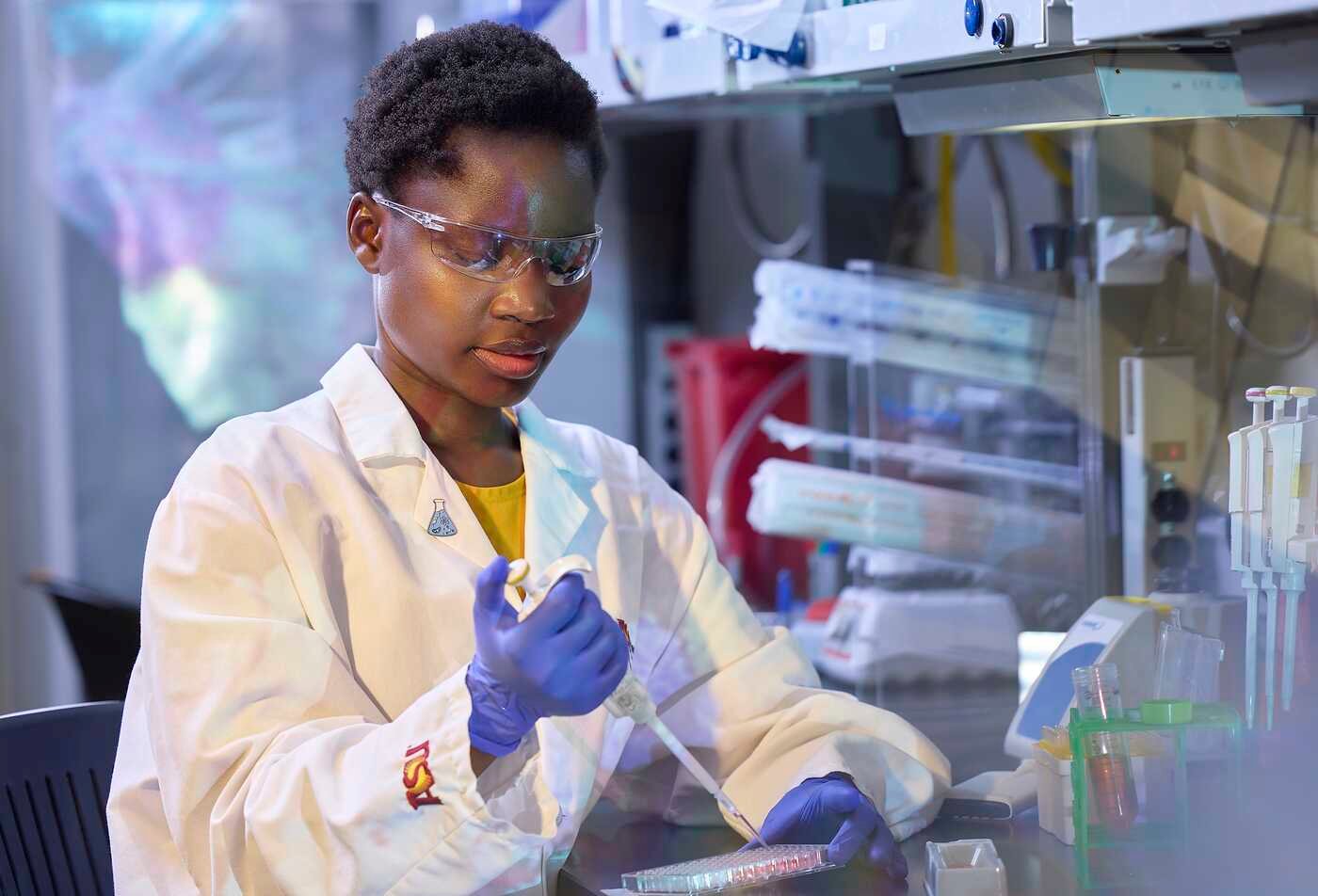 Using a pipette in the lab, a researcher prepares samples for analysis in ASU’s Applied Biological Sciences MS program