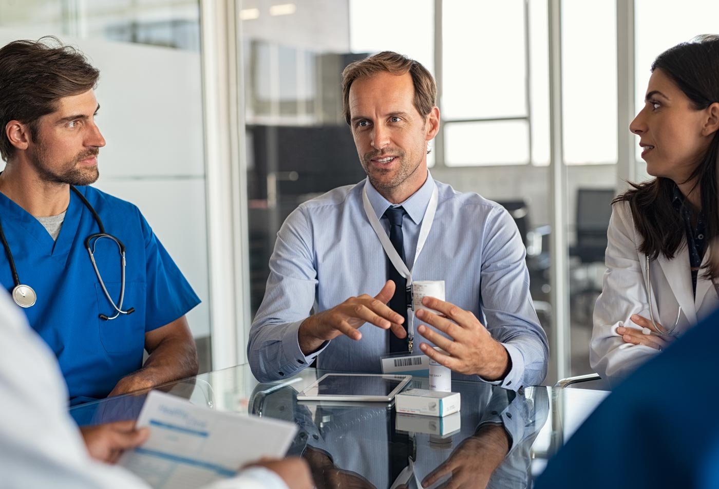 Students, medical professionals talk health care strategies, showcasing collaboration in ASU's Health Care Compliance and Administration, MLS degree.