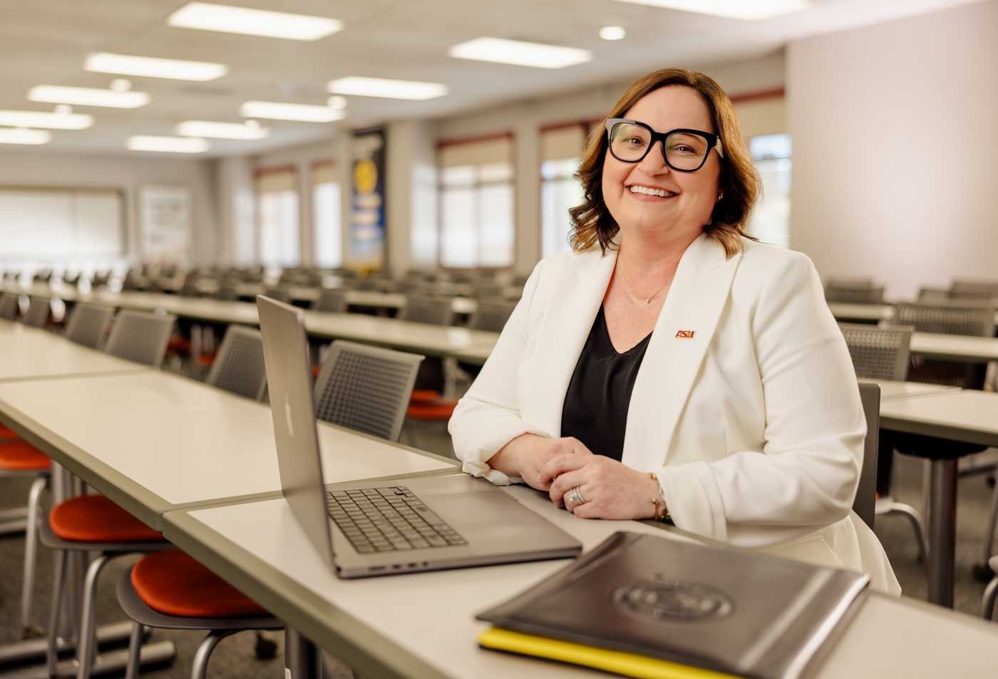 A faculty member in a classroom supports advanced nursing education in the Advanced Nursing Practice, DNP.