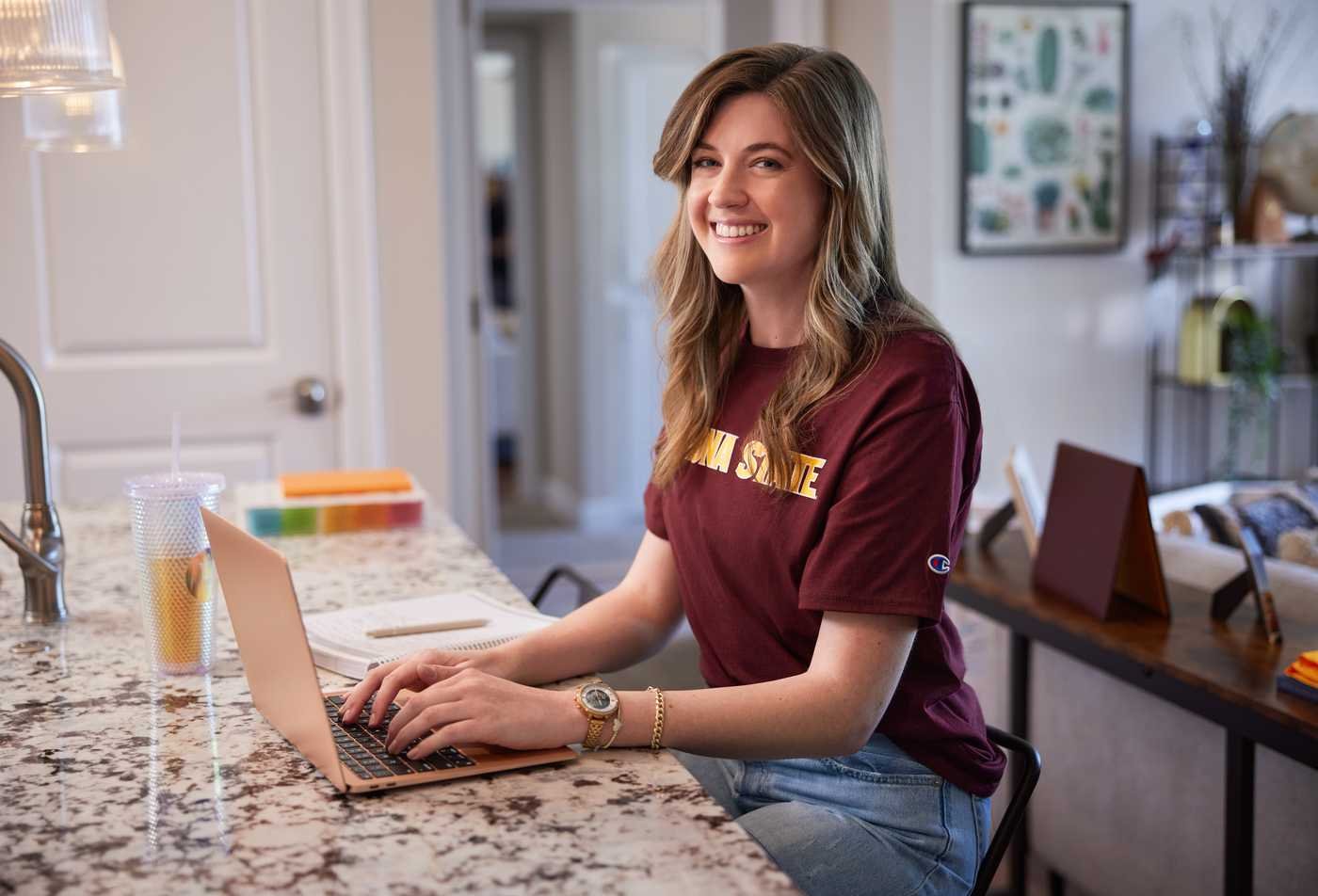 A student studies remotely using a laptop, showcasing flexible learning in the Nursing, MS.