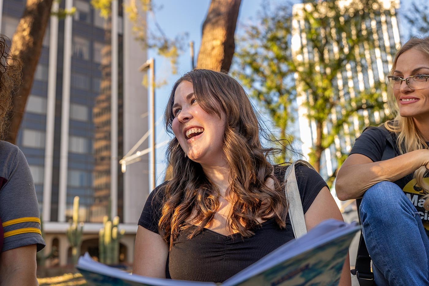 Students hold a lively discussion outdoors, reflecting the collaborative spirit of ASU's Advanced Generalist MSW program.