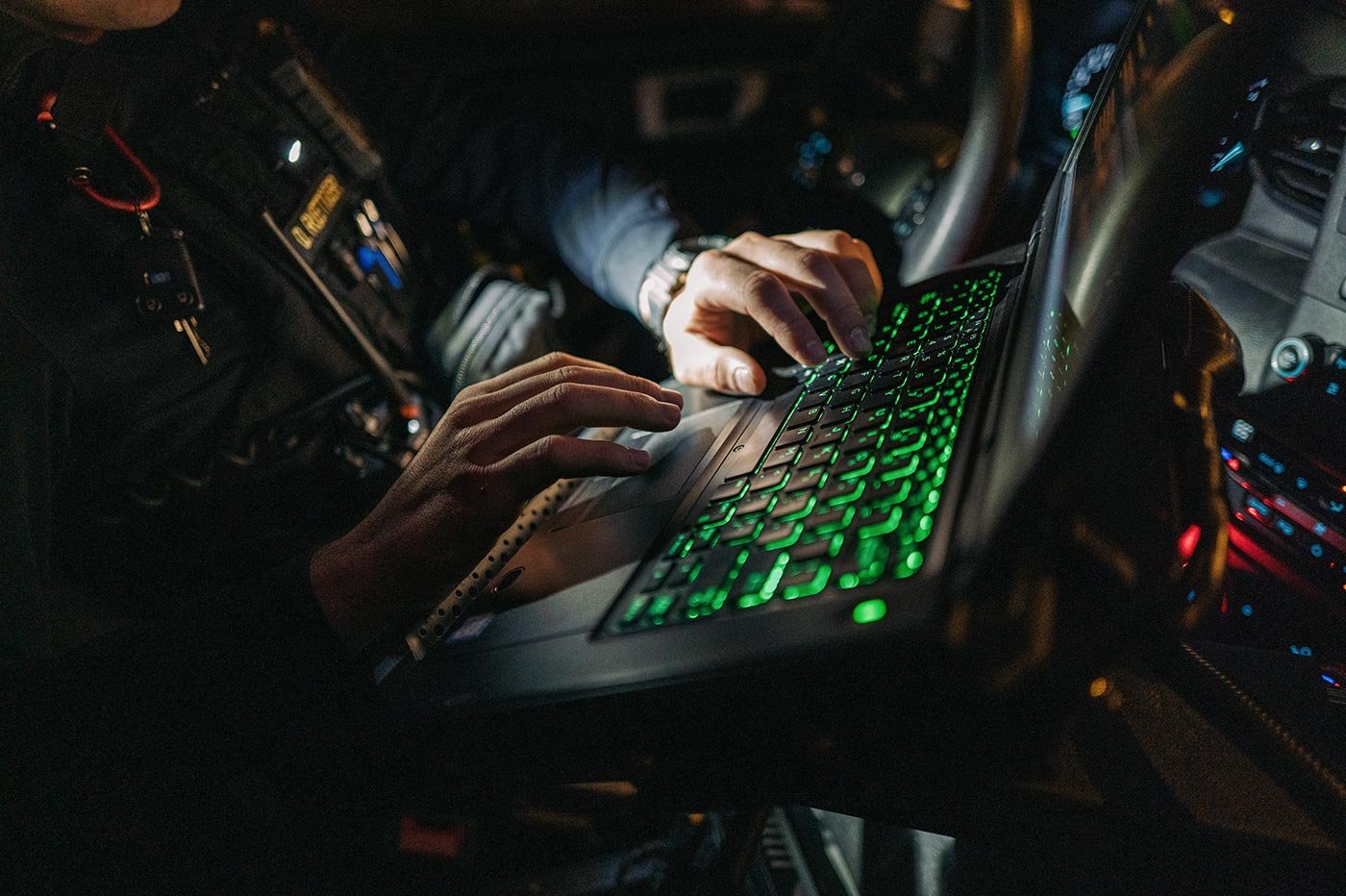 A student works on their laptop in the dark, showing crucial practical experiences in ASU's Criminal Investigations program